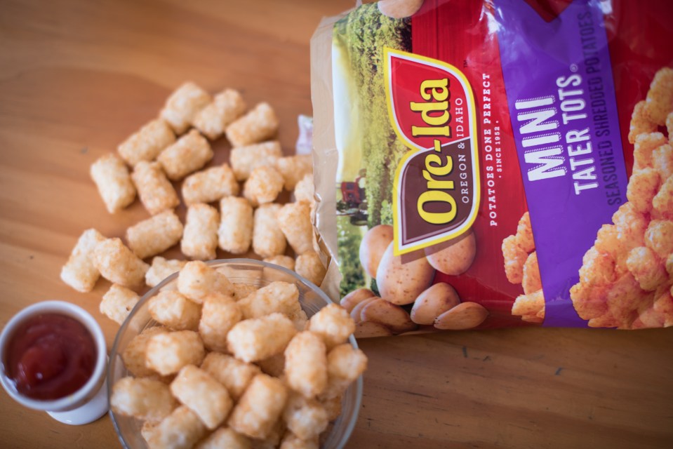 A bag of Heinz Kraft Co. Ore-Ida brand Mini Tater Tots is arranged for a photograph in Dobbs Ferry, New York, U.S., on Wednesday, Feb. 20, 2019. Kraft Heinz Co. is releasing earnings figures on February 21. Photographer: Tiffany Hagler-Geard/Bloomberg via Getty Images