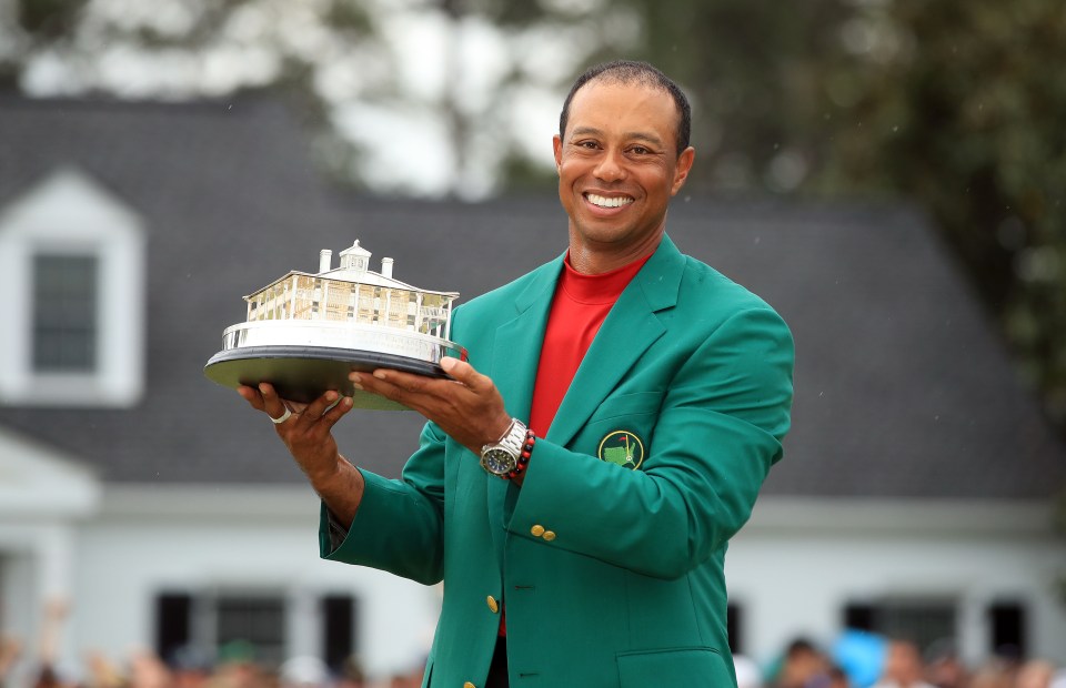 AUGUSTA, GEORGIA - APRIL 14: Tiger Woods of the United States celebrates with the Masters Trophy during the Green Jacket Ceremony after winning the Masters at Augusta National Golf Club on April 14, 2019 in Augusta, Georgia. (Photo by Andrew Redington/Getty Images)