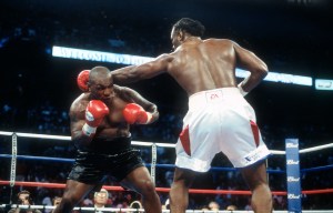 MEMPHIS, TN - JUNE 8:  Lennox Lewis and Mike Tyson fight for the WBC, IBO, IBF, Ring and Lineal heavyweight titles on June 8, 2002 at The Pyramid in Memphis, Tennessee. Lewis won the fight with an 8th round KO. (Photo by Focus on Sport/Getty Images)